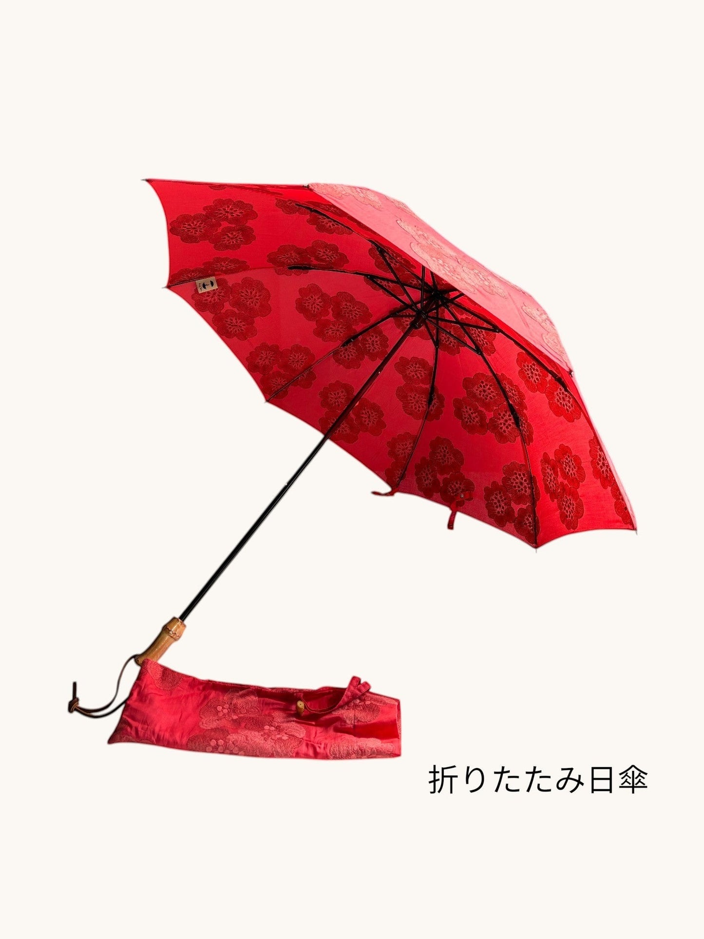 空に映えるいちご色。刺繍のきらめきと、職人仕立ての一本。※在庫限り